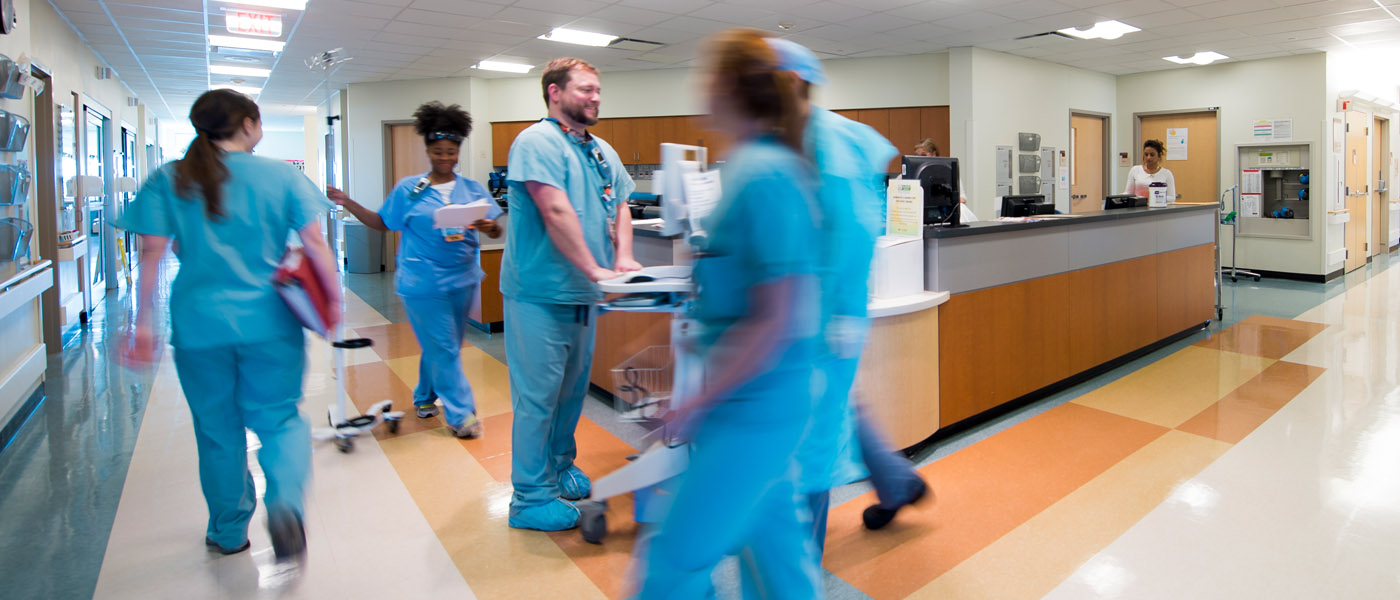 Doctors and nurses walking through a hospital